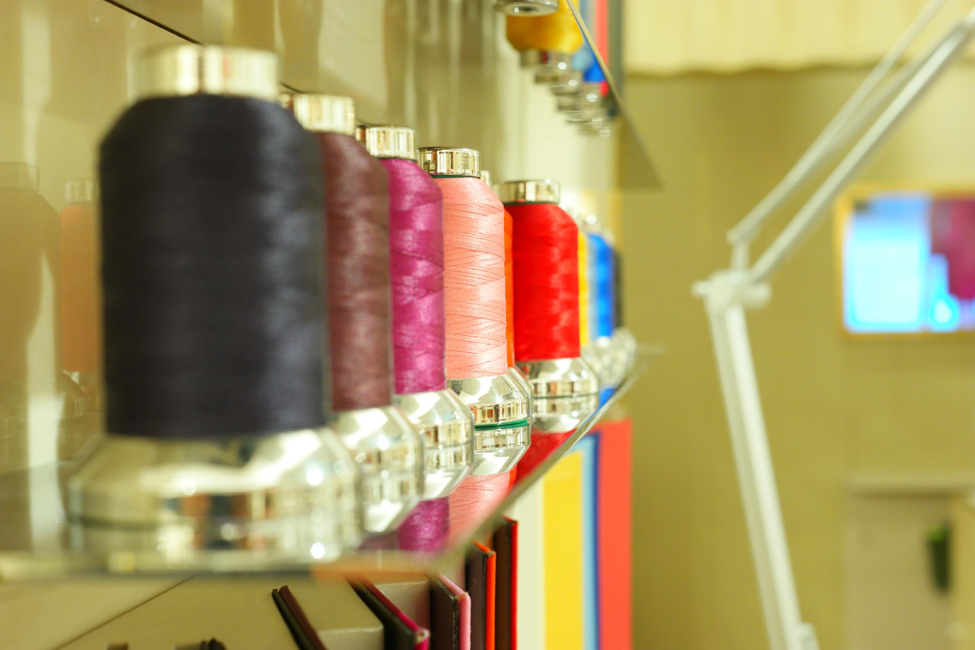 Workshop with embroidery machines and threads