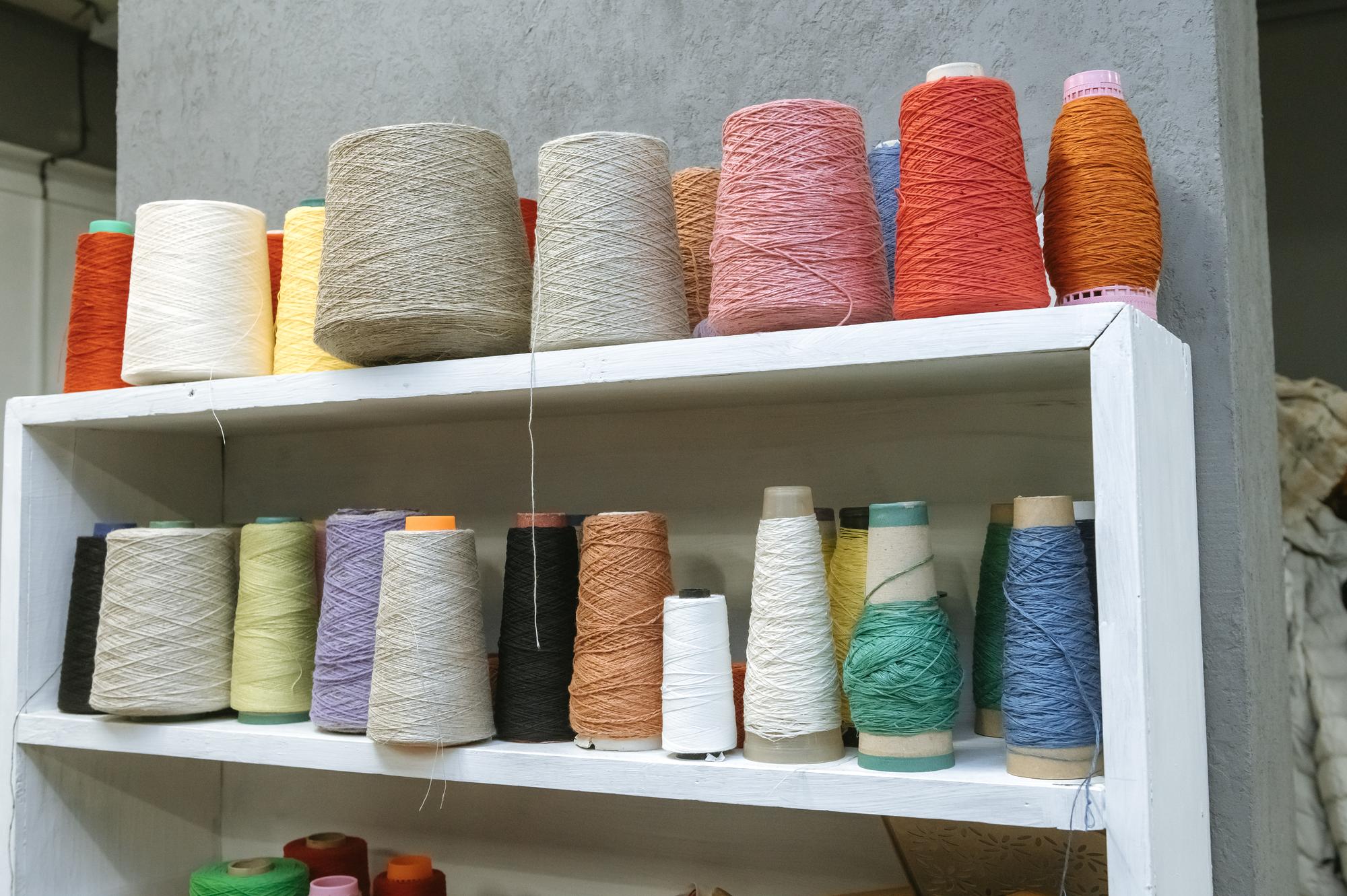 Studio workspace with spools of thread